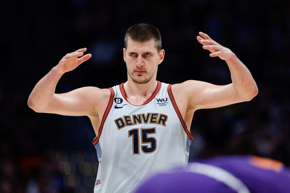 Denver Nuggets center Nikola Jokic (15) gestures in the third quarter against the Phoenix Suns during Game 5 at Ball Arena.