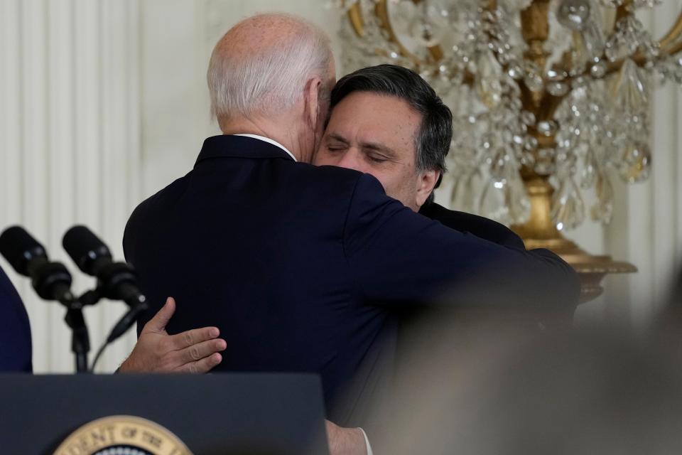 President Joe Biden hugs outgoing White House chief of staff Ron Klain, left, during an event in the East Room of the White House in Washington, Wednesday, Feb. 1, 2023. (AP Photo/Susan Walsh) ORG XMIT: DCSW342