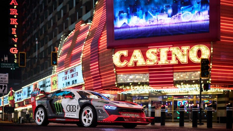 A photo of Ken Block's electric Audi race car parked outside a Las Vegas casino. 