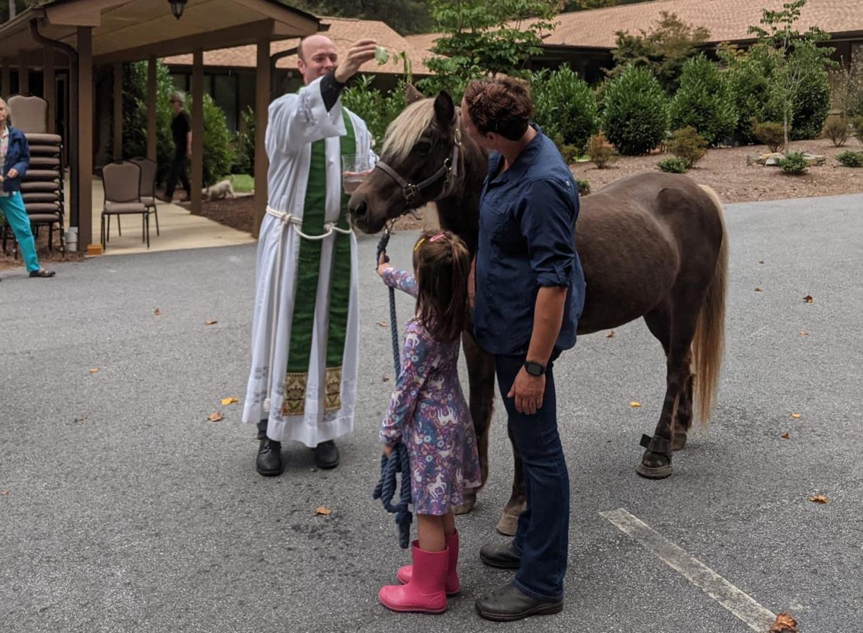 A pony is blessed at The Episcopal Church of St. John in the Wilderness during a past Blessing of the Animals event.