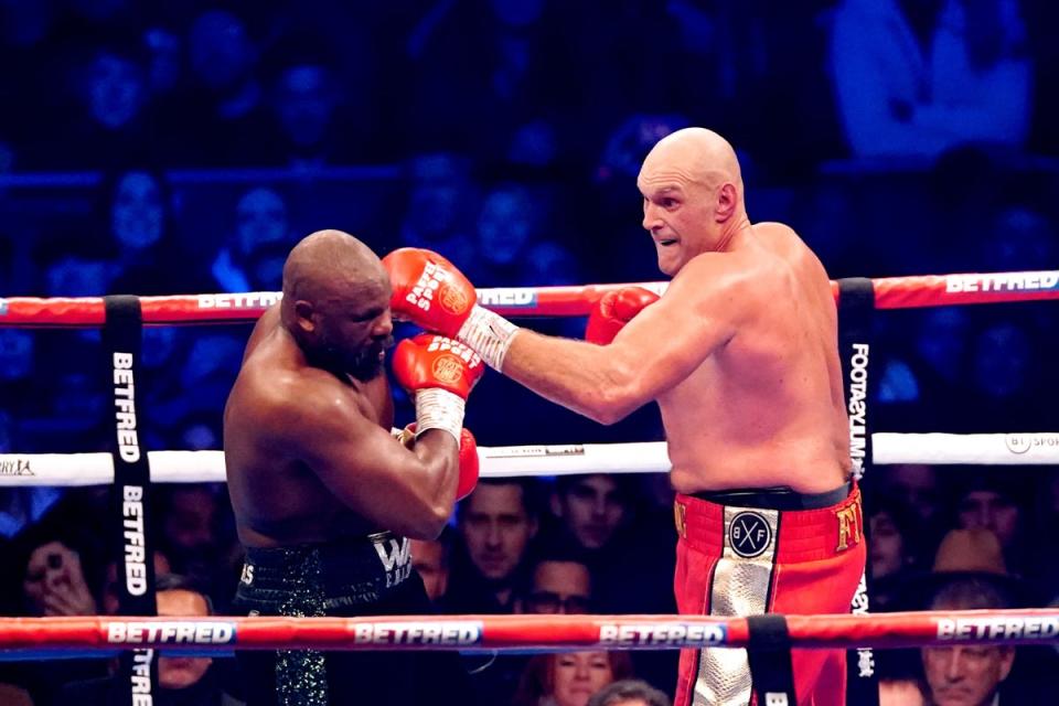 Tyson Fury (right) in action against Derek Chisora during their WBC World Heavyweight title fight at the Tottenham Hotspur Stadium, London. Picture date: Saturday December 3, 2022. (PA Wire)