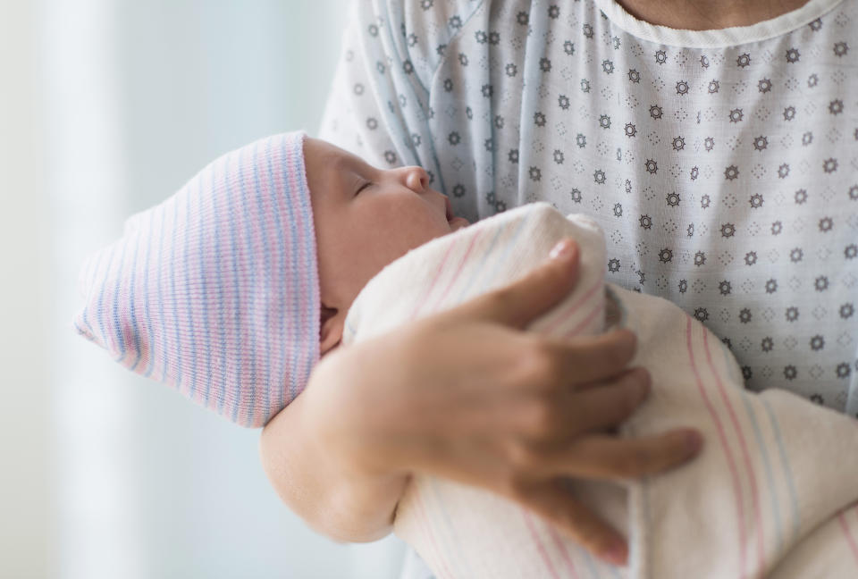 Maternity wards in Rochester, NY are revising their screening policies after a man lied about experiencing symptoms to stay with his expectant wife. (Image via Getty Images) 