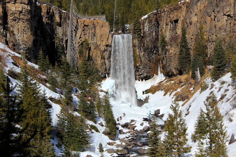 Tumalo Falls roars into the snowy canyon below. The falls can be reached in winter via the Road 4603 Trail.