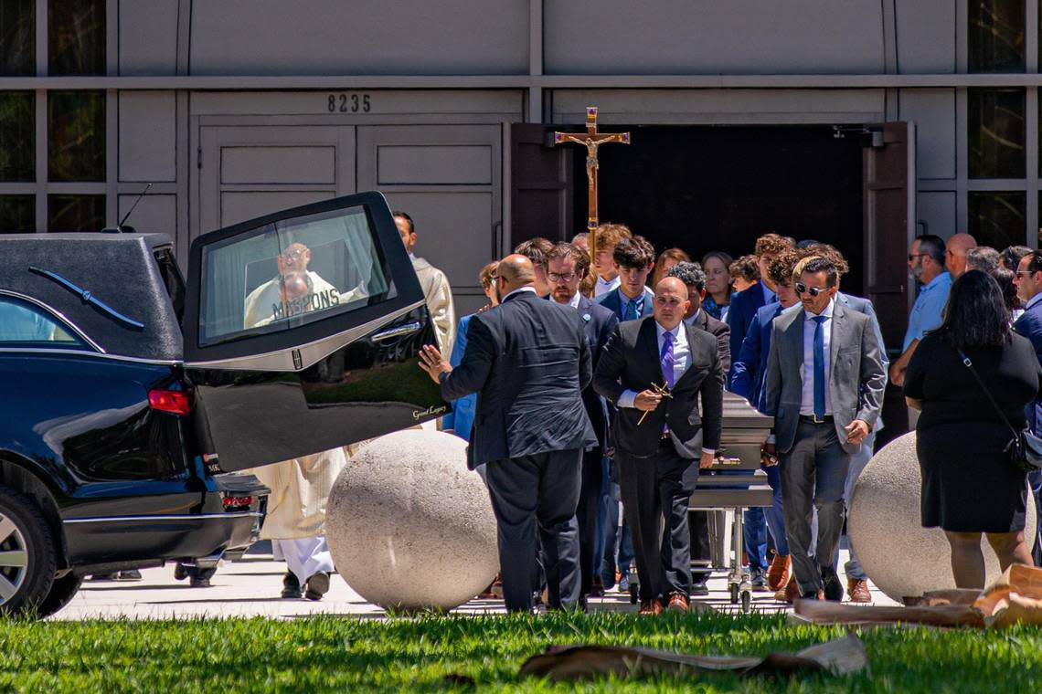 Lucy Fernandez’s casket is carried outside after her funeral Mass at the Church of the Epiphany near South Miami on Monday, Sept. 12, 2022.