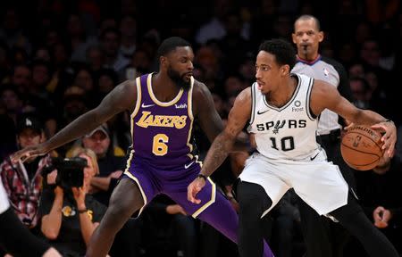 Dec 5, 2018; Los Angeles, CA, USA; San Antonio Spurs guard DeMar DeRozan (10) is guarded by Los Angeles Lakers guard Lance Stephenson (6) during the first half at Staples Center. Kirby Lee-USA TODAY Sports