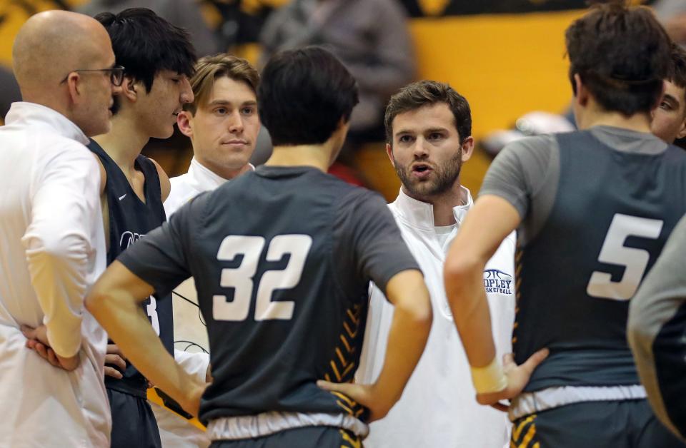 Copley boys basketball coach Nate Moran speaks to his team during the first half at Cuyahoga Falls, Friday, Jan. 27, 2023.