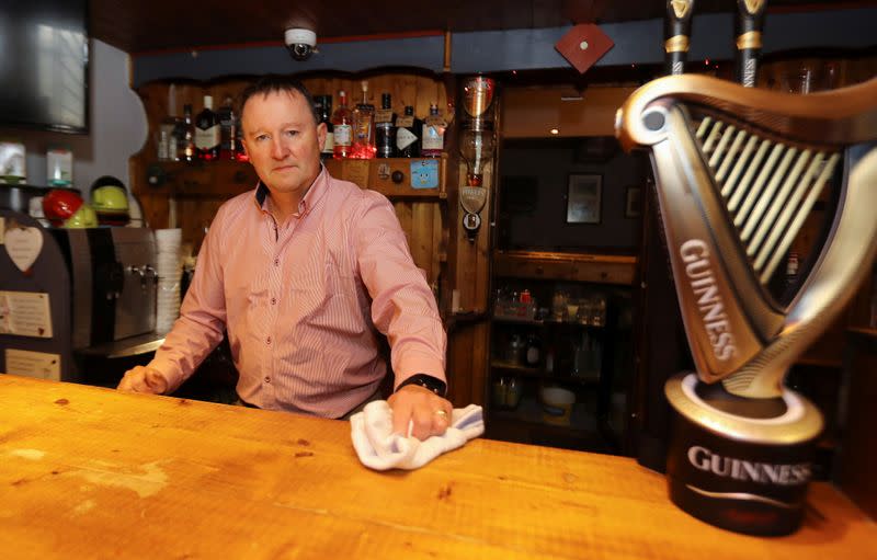 Publican Paul Moynihan prepares for reopening his pub in Donard, County Wicklow, Ireland