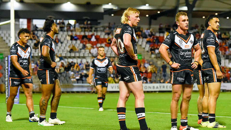 Wests Tigers players look dejected in this photo after their embarrassing hiding by the last-placed Bulldogs. 