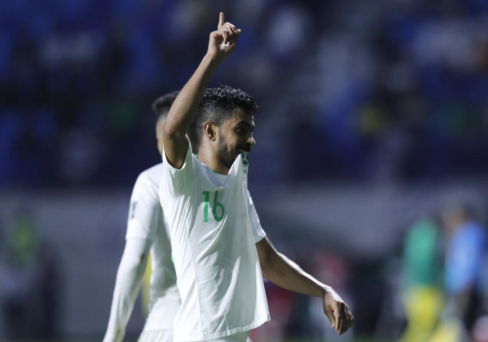 Saudi Arabia's midfielder Hussain Al-Mogahwi, celebrates his goal during the AFC Asian Cup group E soccer match between Lebanon and Saudi Arabia at Al Maktoum Stadium in Dubai, United Arab Emirates, Saturday, Jan. 12, 2019. (AP Photo/Hassan Ammar)