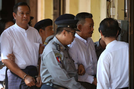 Kyi Lin and Aung Win Zaw, who are accused of the murder of Muslim lawyer Ko Ni, arrive at Insein court in Yangon, Myanmar February 15, 2019. REUTERS/Ann Wang