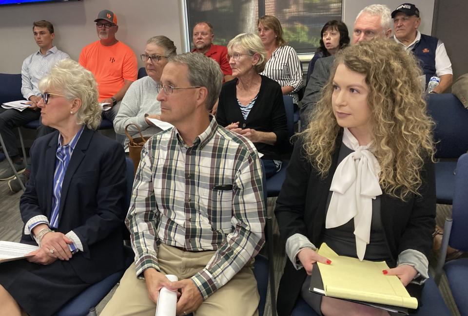 Judge Brittany Stevens, right, sits in audience seat on Tuesday, Oct. 10, 2023, before the state of the Smyrna Town Council meeting next to her parents, Sherri and Larry Stevens. The Smyrna Town Council is considering a proposed change to discontinue the 30-year General Sessions criminal court operation.