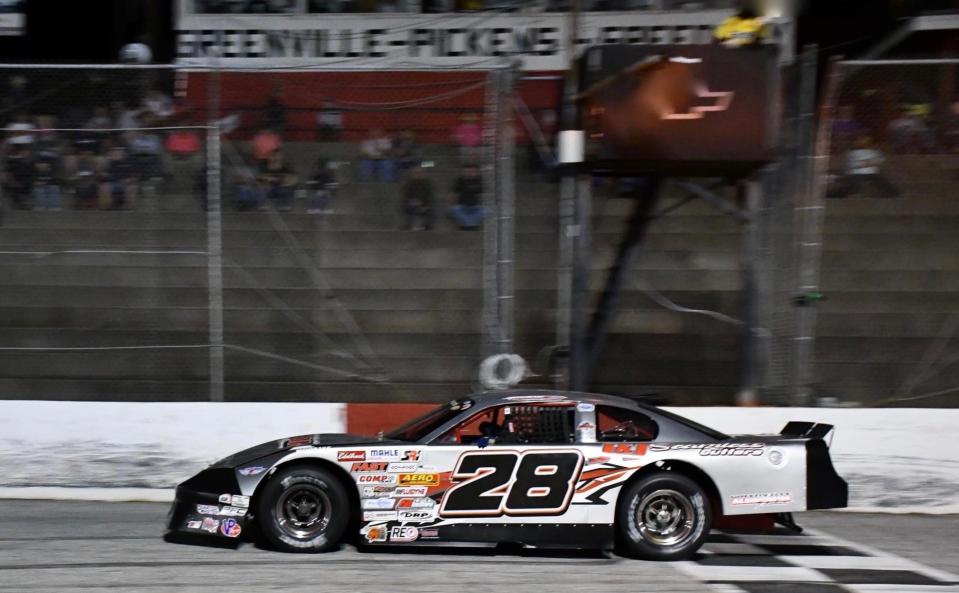 Jackie Manley's number 28 race car crossing the checkered line during the Old North State National CARS Tour at Greenville-Pickens Speedway in October of 2020.