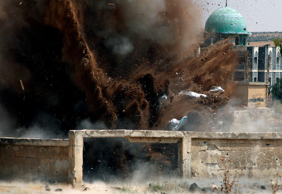 Civil defense members safely detonate cluster bombs in Deraa