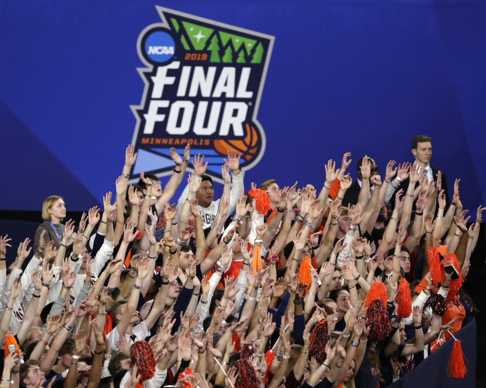 Virginia fans cheer during the second half in the championship of the Final Four NCAA college basketball tournament against Texas Tech, Monday, April 8, 2019, in Minneapolis. (AP Photo/Matt York)