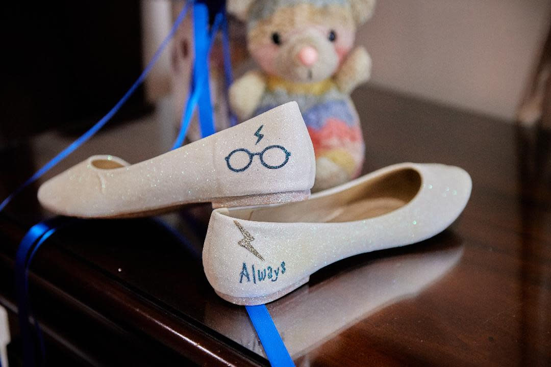 The bride's shoes were embroidered with Harry Potter glasses and his famous lightning bolt scar. (Supplied)