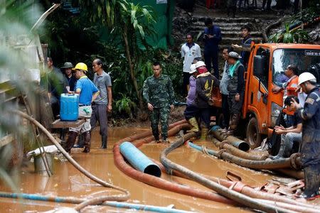 Soldiers and rescue workers work near Tham Luang cave complex, as an ongoing search for members of an under-16 soccer team and their coach continues, in the northern province of Chiang Rai, Thailand, July 2, 2018. REUTERS/Soe Zeya Tun