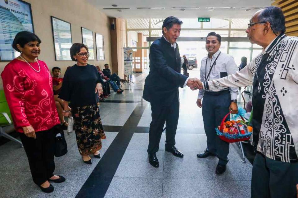 The Malay Mail Care Fund trustees meet up at University Malaya Specialist Centre before presenting eight-year-old Adam Miqail with the special gift, May 24, 2019.