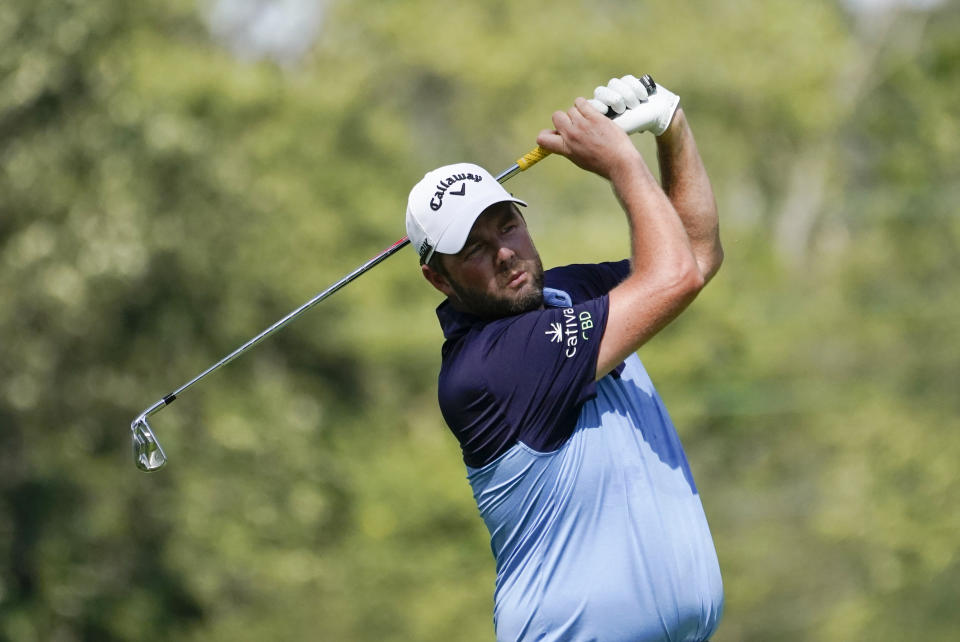 Marc Leishman, of Australia, hits from the 12th tee during the first round of the BMW Championship golf tournament, Thursday, Aug. 27, 2020, at Olympia Fields Country Club in Olympia Fields, Ill. (AP Photo/Charles Rex Arbogast)