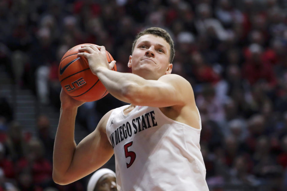 FILE - In this Jan. 11, 2020, file photo, San Diego State forward Yanni Wetzell during the second half of an NCAA college basketball game against Boise State in San Diego. It's almost like coach Brian Dutcher and the San Diego State Aztecs won the lottery. Tired of losing at their old schools, big man Yanni Wetzell and guards Malachi Flynn and KJ Feagin transferred to San Diego State after being lured by the prospect of winning and going to the NCAA Tournament. And boy, have they ever won, to the point that they've matched some accomplishments by the breakthrough 2010-11 team led by the most famous player in program history, Kawhi Leonard. (AP Photo/Gregory Bull, File)