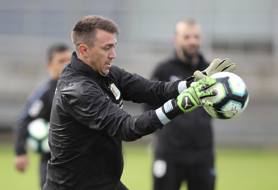 Uruguay goalkeeper Fernando Muslera catches a ball during a practice session in Porto Alegre, Brazil, Wednesday, June 19, 2019. Uruguay will face Japan tomorrow in a Copa America Group C soccer match. (AP Photo/Edison Vara)