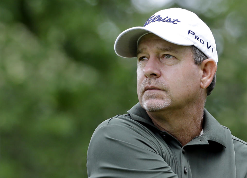 FILE - Bart Bryant watches his tee shot on the ninth hole during the second round of the Encompass Championship golf tournament in Glenview, Ill., June 21, 2014. Professional golfer Bryant was killed and his wife was injured when a truck slammed into their SUV while they were stopped in a line of vehicles on a central Florida roadway for a construction crew, authorities said Wednesday, June 1, 2022. (AP Photo/Nam Y. Huh, File)