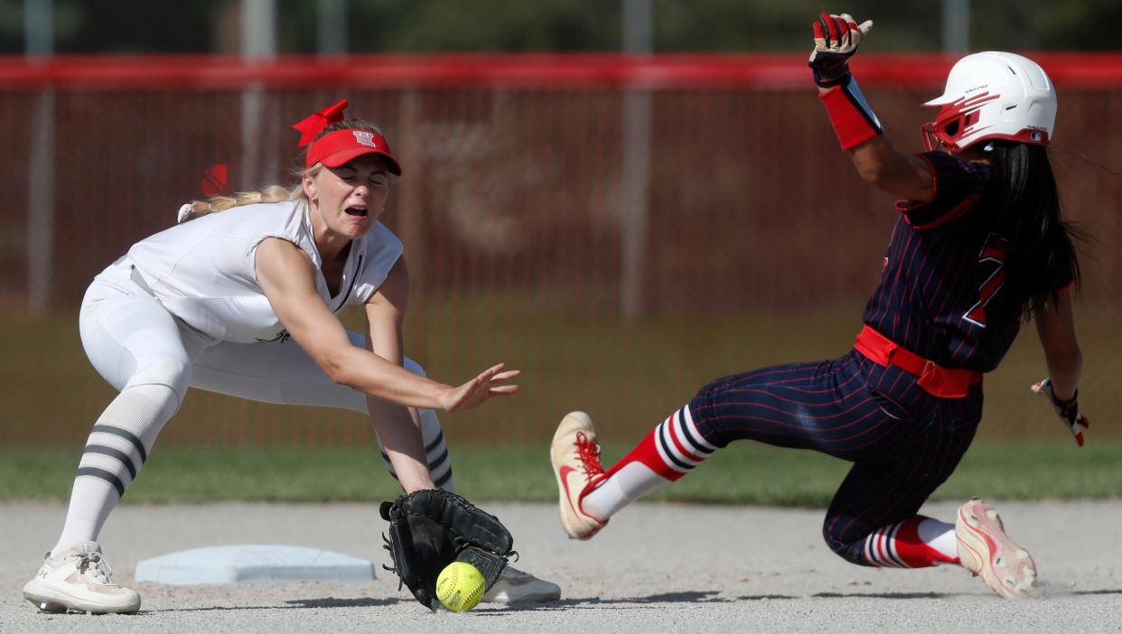 West Lafayette Red Devils shortstop Adrianne Tolen (7) catches a throw to attempt to tag out Tri-County Cavaliers Bella Dominguez (7) at second base during the IHSAA softball game, Wednesday, May 10, 2023, at West Lafayette High School in West Lafayette, Ind. West Lafayette won 15-7.
