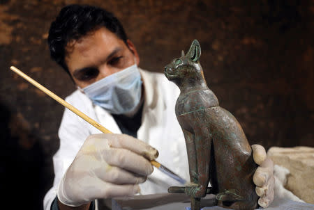 An archaeologist works inside the tomb of Khufu-Imhat, at the Saqqara area near its necropolis, in Giza, Egypt November 10, 2018. REUTERS/Mohamed Abd El Ghany