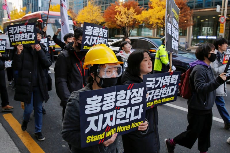 Students and young people chant slogans during a demonstration to support Hong Kong pro-democracy protesters in Seoul