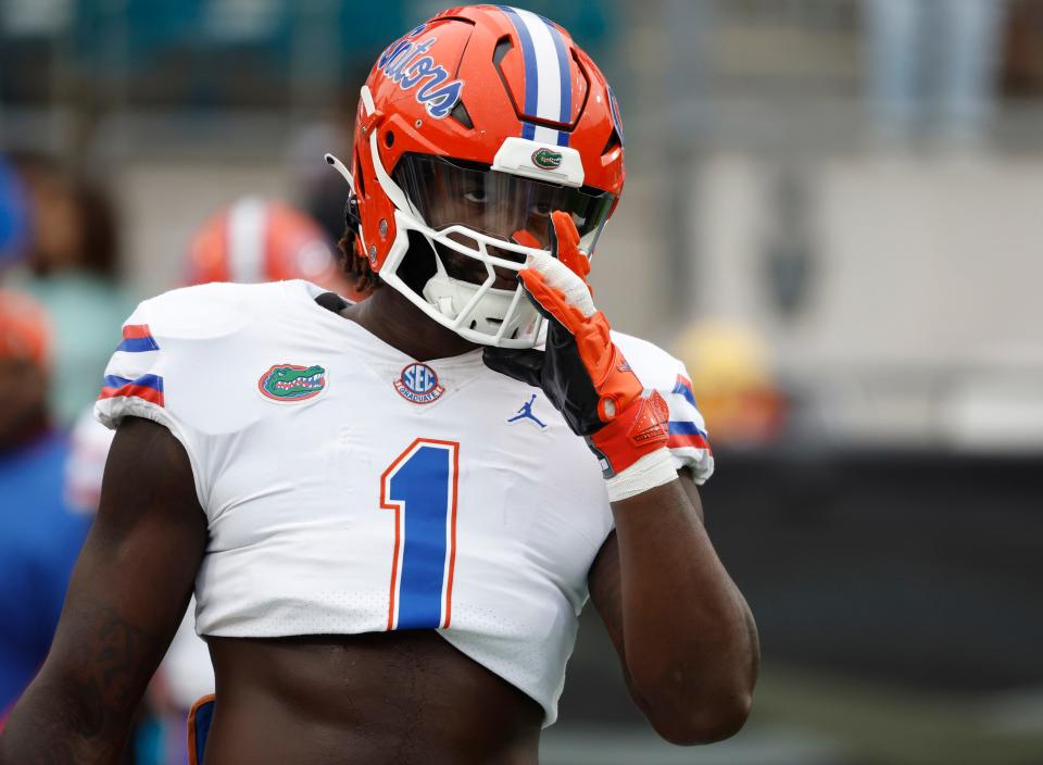 Florida linebacker Brenton Cox Jr. (1), shown prior to the game against Georgia, has been dismissed from the team.