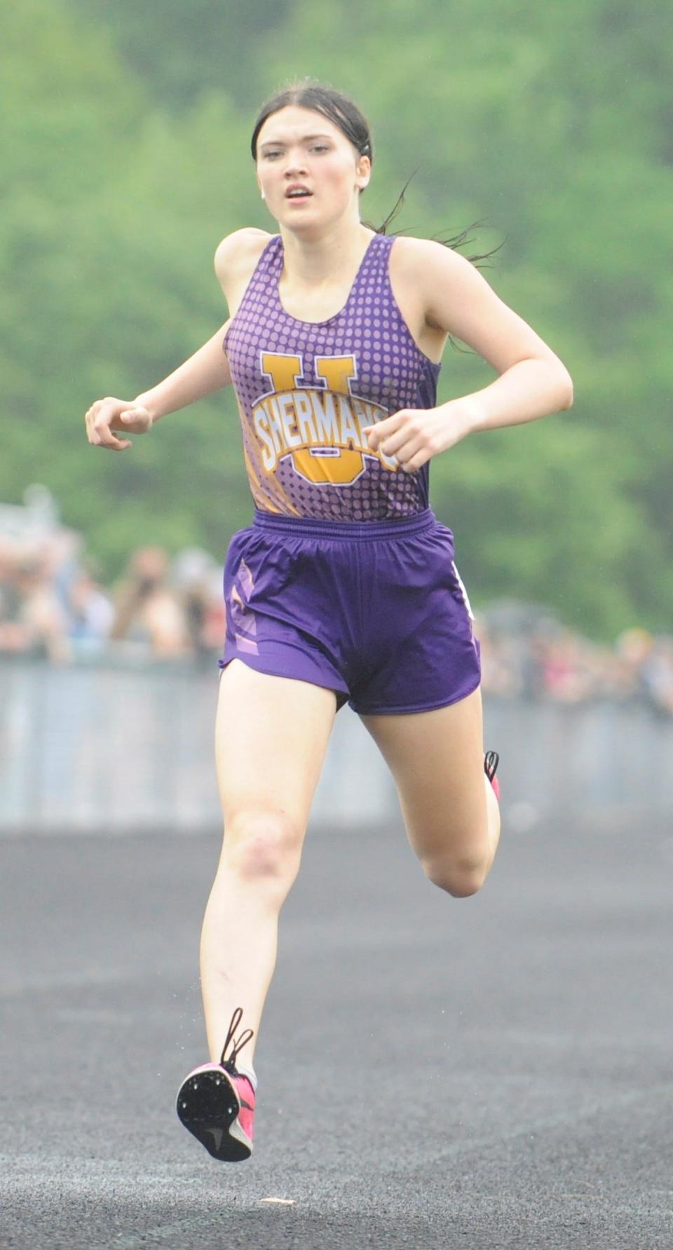 Unioto's Cameron Walker finishes the final lap of the girls 800m run during the Scioto Valley Conference track and field championships at Huntington High School on May 12, 2023.
