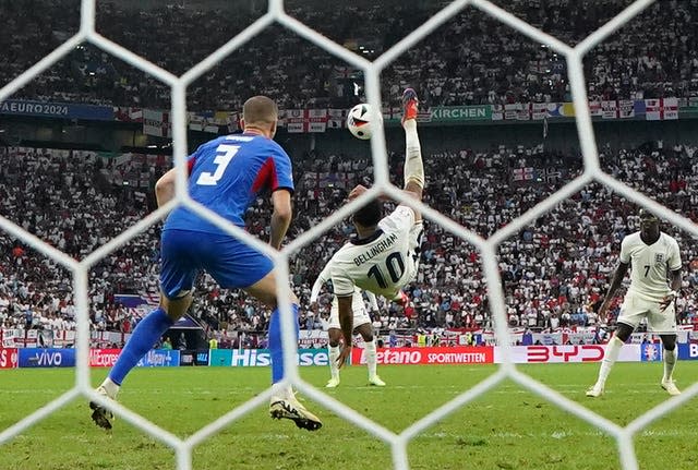 Jude Bellingham, centre, scores England’s equaliser against Slovakia with a bicycle kick