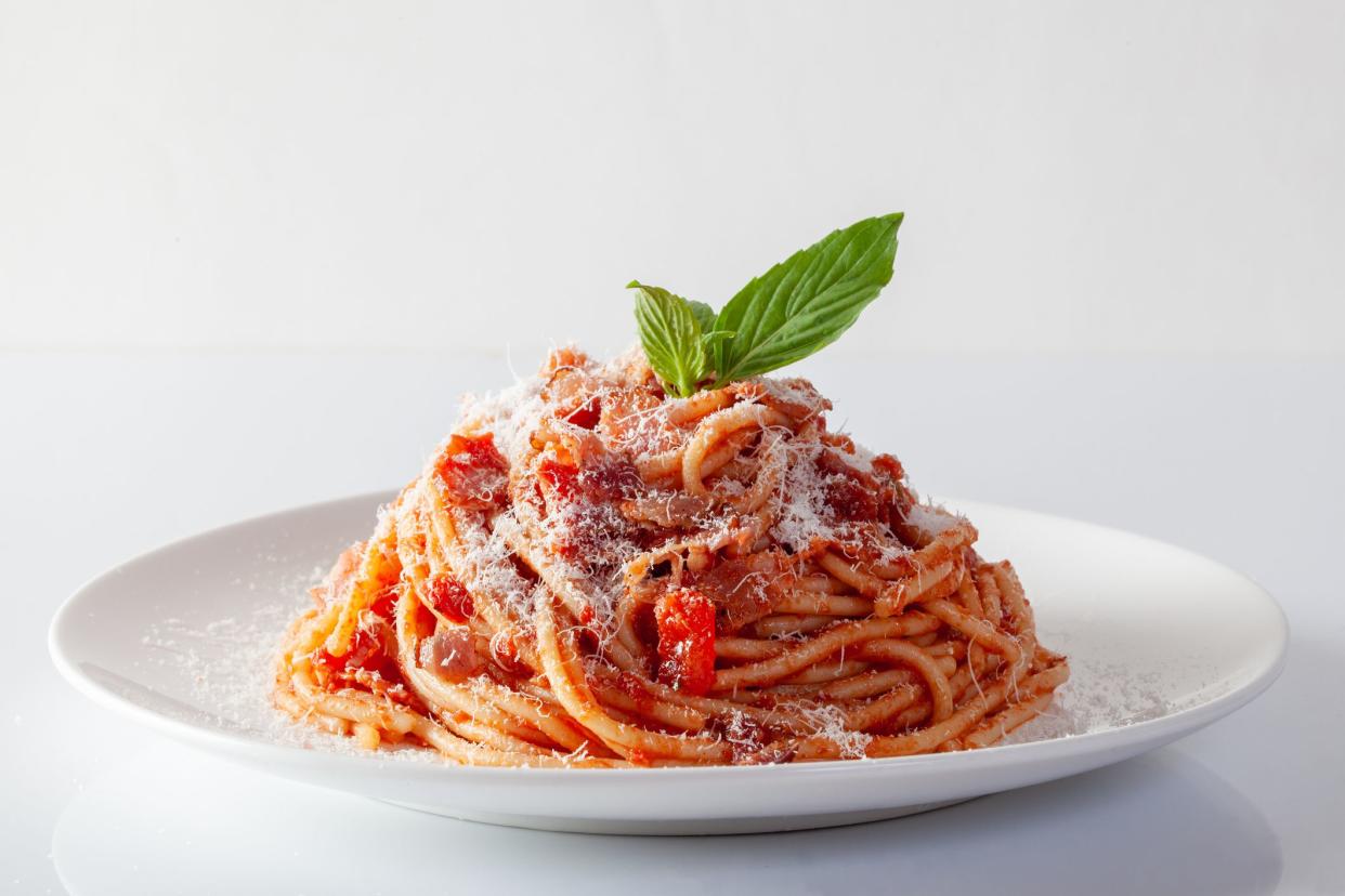 Spaghetti in a dish on a white background