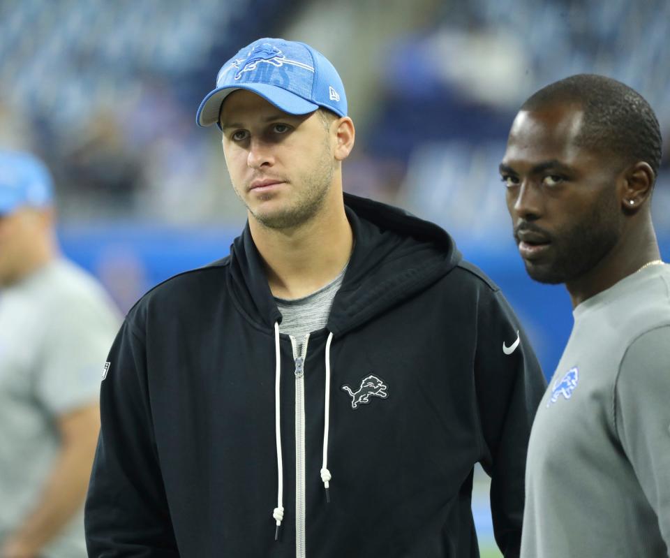 Detroit Lions quarterback Jared Goff (16) talks with quarterbacks coach J.T. Barrett before the game against the Jacksonville Jaguars, Saturday, August 19, 2023 at Ford Field.