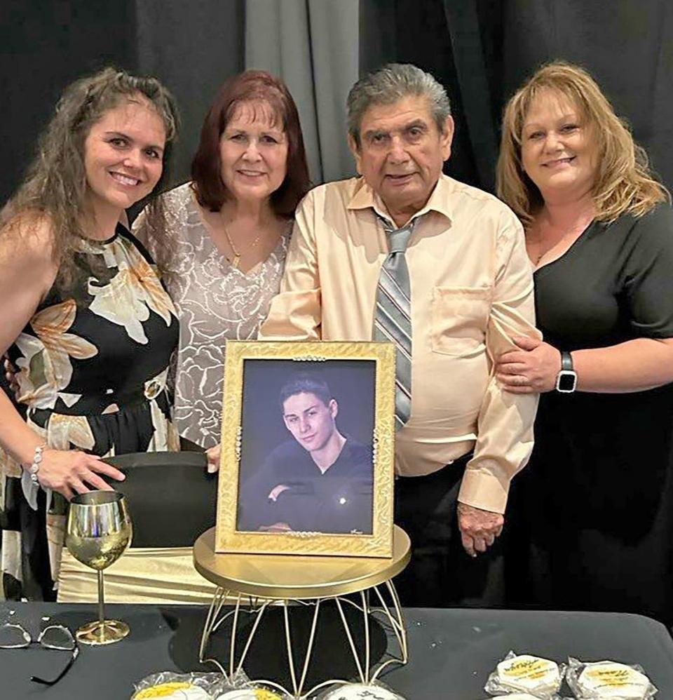 The Chavez Family (from left) Cassy Gibbons, Gerda and Chuck Chavez and Tanja Barela, with a photograph of the late Taustin Chavez, celebrated the couple's 50th wedding anniversary June 22, 2023.