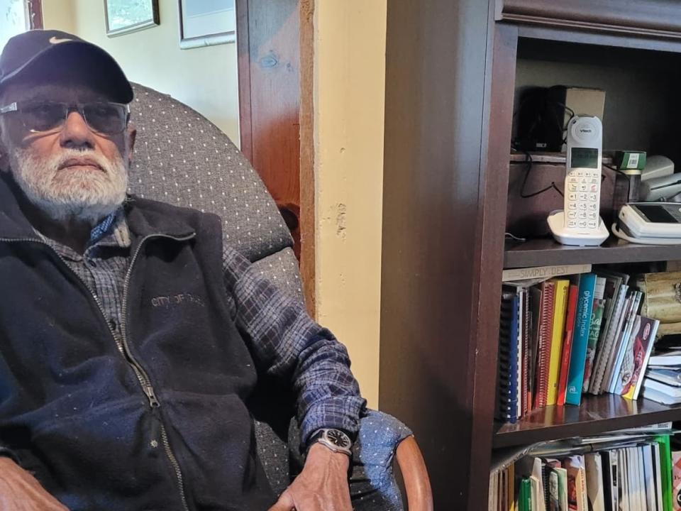 Philip Ali, 88, lost almost $30K after he answered a call from scammers claiming to be Royal Canadian Mounted Police officers. He believed he was helping his grandson, who was recently married and training to be a paramedic, get out of drug and weapons charges. (Submitted by Karen Bull - image credit)