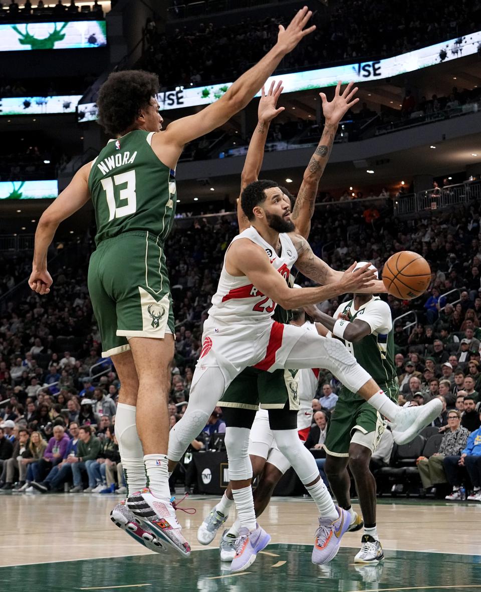 Toronto Raptors guard Fred VanVleet (23) gets past Milwaukee Bucks forward Jordan Nwora (13) to score  during the first half of their game Tuesday, January 17, 2023 at Fiserv Forum in Milwaukee, Wis.