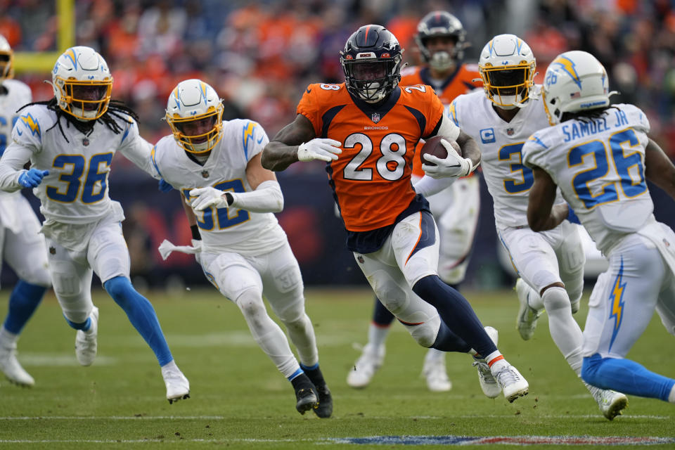 Denver Broncos running back Latavius Murray (28) runs against the Los Angeles Chargers during the first half of an NFL football game in Denver, Sunday, Jan. 8, 2023. (AP Photo/Jack Dempsey)