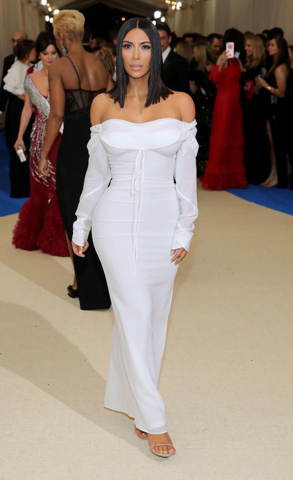 <p>Kim Kardashian West wore an off-the-shoulder white dress by designer Vivienne Westwood. The reality star noticeably wasn’t wearing any jewelry. (Photo by Neilson Barnard/Getty Images) </p>