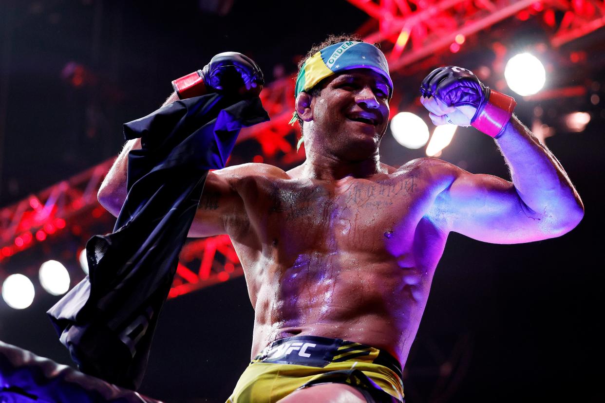 MIAMI, FLORIDA - APRIL 08: Gilbert Burns of Brazil celebrates after his unanimous decision victory against Jorge Masvidal in their welterweight bout during UFC 287 at Kaseya Center on April 08, 2023 in Miami, Florida. (Photo by Carmen Mandato/Getty Images)