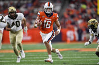 Syracuse quarterback Garrett Shrader (16) runs with the ball during the first half of an NCAA college football game against Wake Forest in Syracuse, N.Y., Saturday, Oct. 9, 2021. (AP Photo/Adrian Kraus)