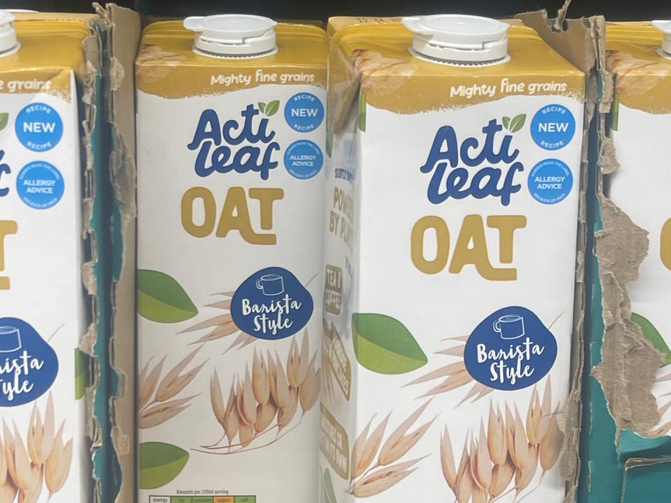 cartons of oat milk on the shelves at aldi