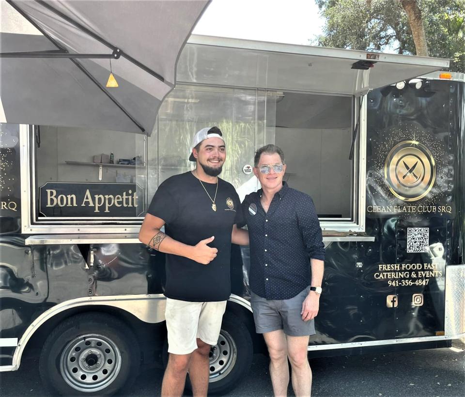 Bobby Flay, right, at Clean Plate Club SRQ food truck in Sarasota with chef and owner Jarek Rosaire Dymek.