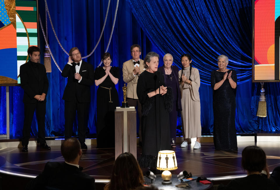 LOS ANGELES, CALIFORNIA – APRIL 25: (EDITORIAL USE ONLY) In this handout photo provided by A.M.P.A.S., (L-R) Joshua James Richards, Dan Janvey, Mollye Asher, Peter Spears, Frances McDormand, Charlene Swankie, Chloé Zhao, and Linda May accept the Best Picture award for ‘Nomadland' onstage during the 93rd Annual Academy Awards at Union Station on April 25, 2021 in Los Angeles, California. (Photo by Todd Wawrychuk/A.M.P.A.S. via Getty Images)