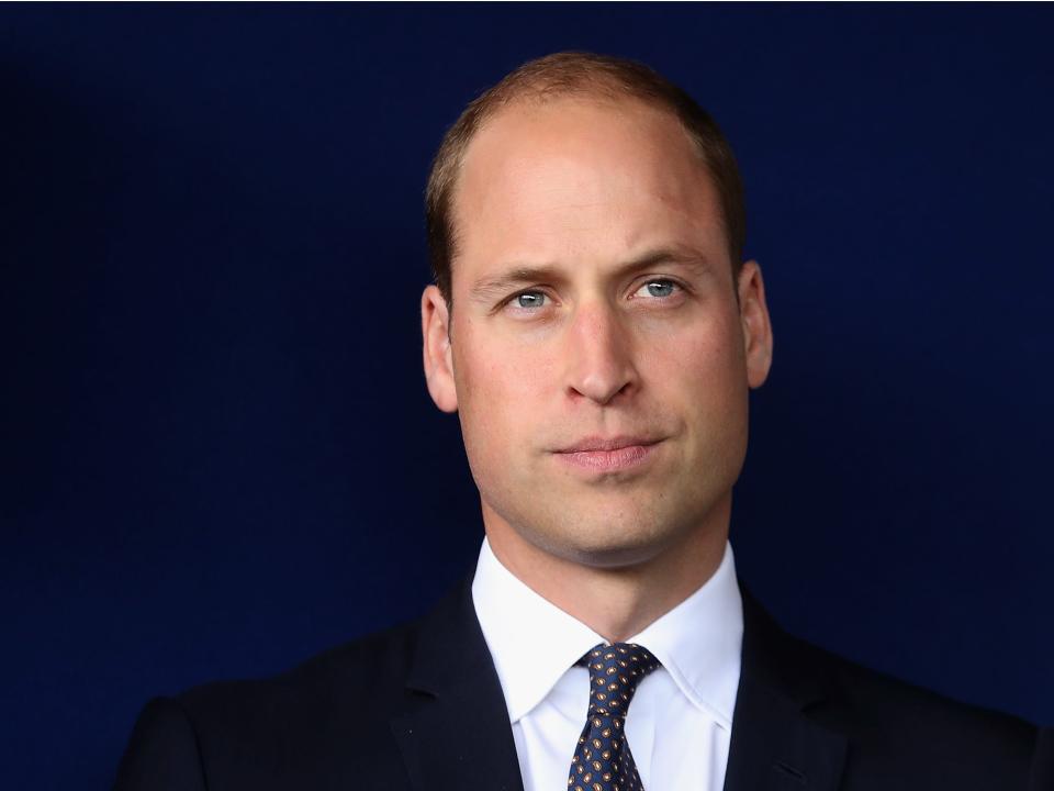 Prince William against a dark background