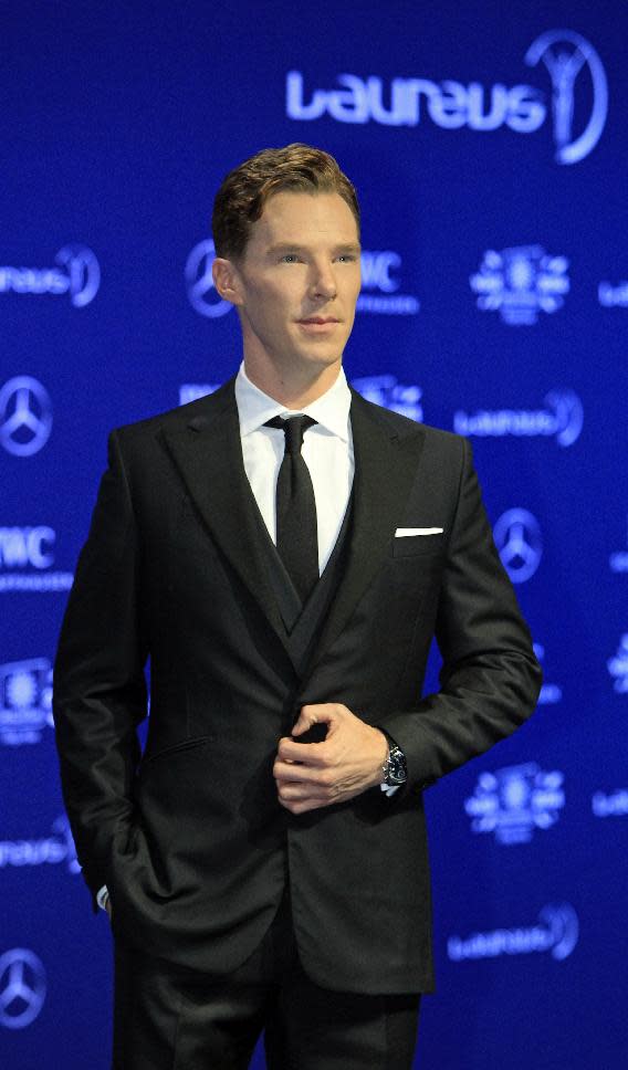 British actor Benedict Cumberbatch poses for photos upon arriving at the Laureus World Sports Awards in Kuala Lumpur, Malaysia, Wednesday, March 26, 2014. (AP Photo/Lai Seng Sin)