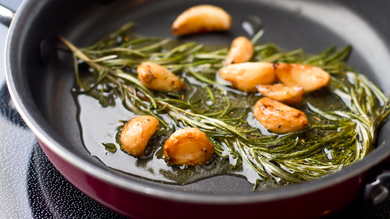 rosemary with garlic on pan