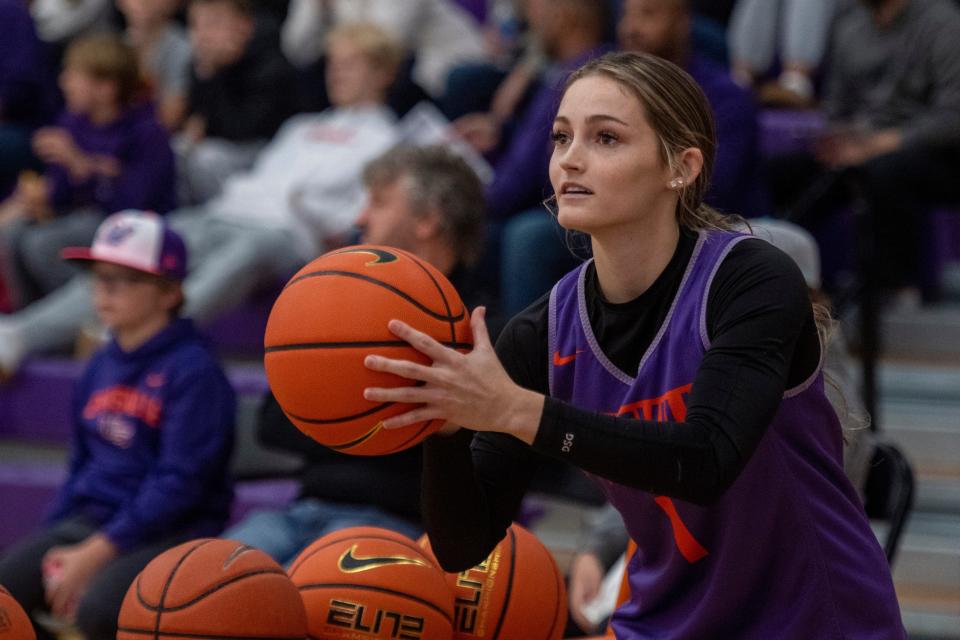 Evansville’s Anna Newman (1) eyes a three-point shot during Meeks Madness at the Meeks Family Fieldhouse in Evansville, Ind., Saturday evening, Oct. 15, 2022. 