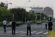 A car with a sign which reads "Special transport for Foreign Affairs Reception", center is seen ahead of a convoy of cars that is believed to include U.S. deputy secretary Wendy Sherman as they prepare to enter the Tianjin Binhai No. 1 Hotel where U.S. and Chinese officials are expected to meet in Tianjin municipality in China on Sunday, July 25, 2021. Deputy Secretary of State Wendy Sherman travelled to China this weekend on a visit that comes as tensions between Washington and Beijing soar on multiple fronts, the State Department said Wednesday. (AP Photo/Ng Han Guan)