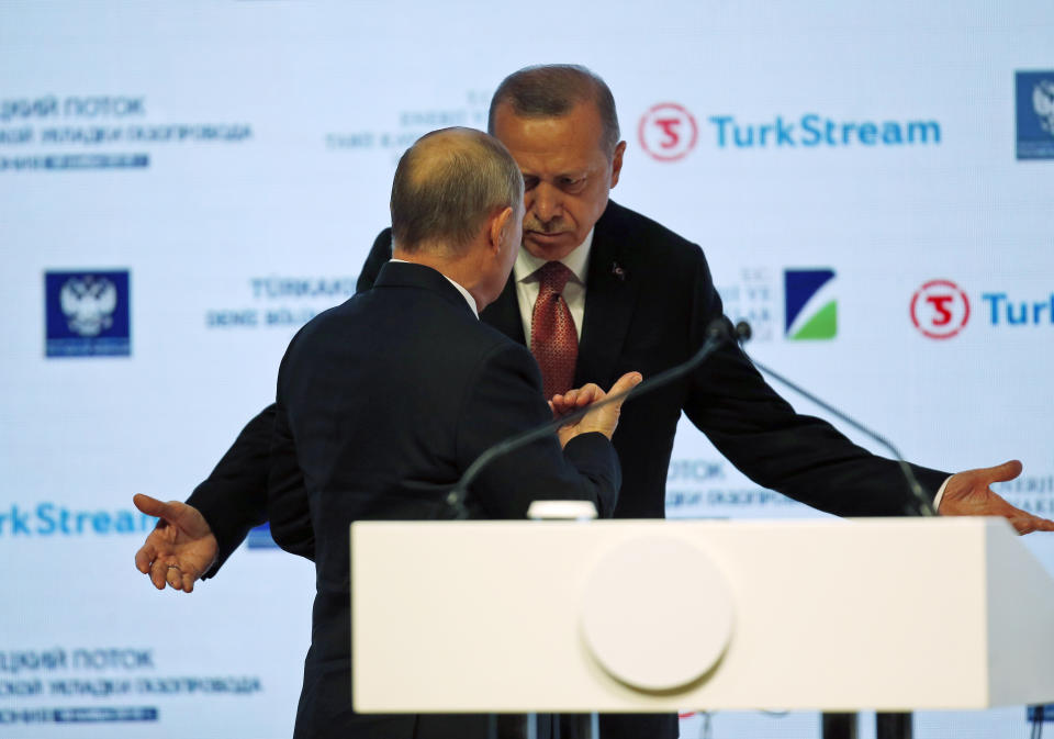 Russian President Vladimir Putin, left, and Turkey's President Recep Tayyip Erdogan, arrive at an event marking the completion of one of the phases of the Turkish Stream natural gas pipeline, in Istanbul, Monday, Nov. 19, 2018. The two 930-kilometer (578-mile) lines when finished are expected to carry 31.5 billion cubic meters (1.1 trillion cubic feet) of Russian natural gas annually to European markets, through Turkish territories. (AP Photo/Lefteris Pitarakis)