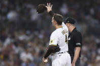 San Diego Padres starting pitcher Blake Snell gestures toward Philadelphia Phillies' Bryce Harper after hitting him with a pitch during the fourth inning of a baseball game Saturday, June 25, 2022, in San Diego. (AP Photo/Derrick Tuskan)